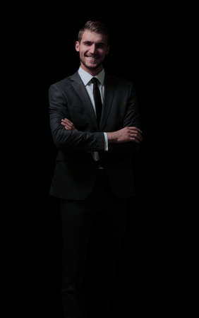 Handsome elegant business man isolated on blackの写真素材