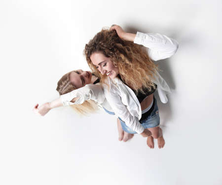 two young female models standing next to each otherの写真素材
