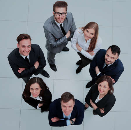 business people with their hands together in a circle