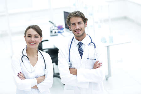 Portrait of two successful professional doctors workers in coatsの写真素材