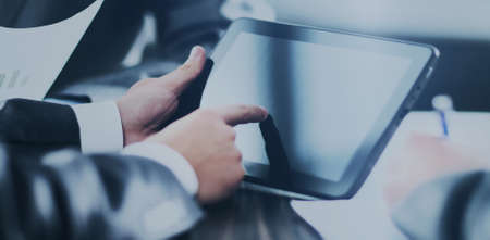 man holding digital tablet, closeup