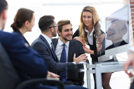 employees discussing financial chartsの写真素材