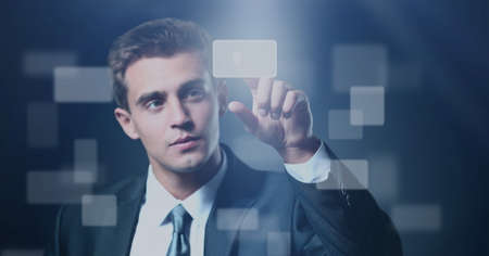 business man pressing a virtual buttonの写真素材