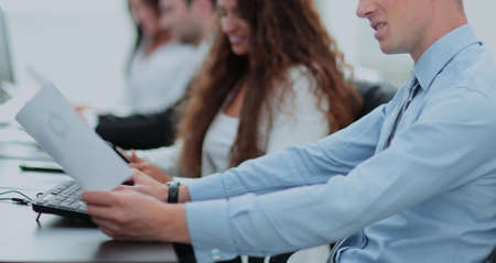Business people working around table in modern officeの写真素材