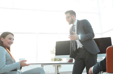 members of the business team talking in the officeの写真素材