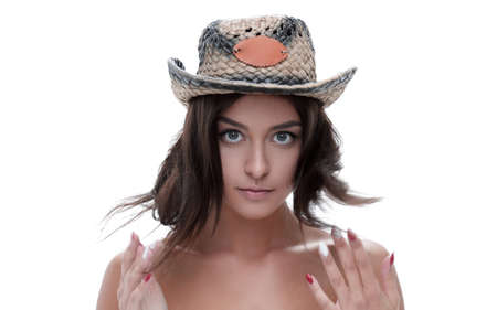 Portrait of a beautiful young woman in cowboy hat