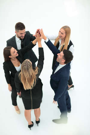 group of business people shows his success hands clasped togetherの写真素材