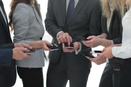 closeup.business team using smartphones .の写真素材