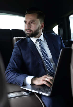 Business people use a laptop