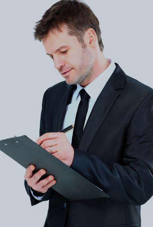 businessman writing on clipboard wear elegant suit and tie.の写真素材