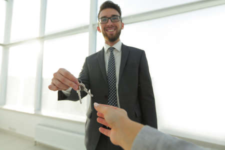 Estate Agent Giving House Keys To Personの写真素材