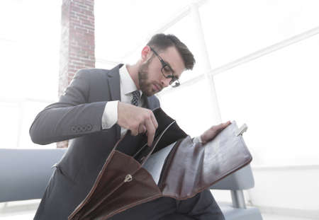 Detail of a businessman holding his briefcaseの写真素材