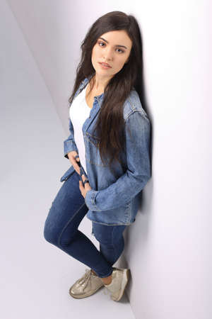 Beautiful young student isolated on whiteの写真素材