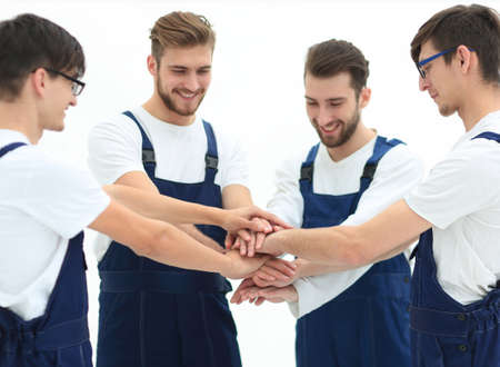 Close up top view of young movers putting their hands together.の写真素材