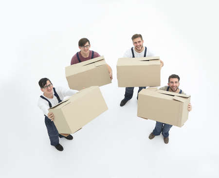Young movers holding boxes isolated on white background,