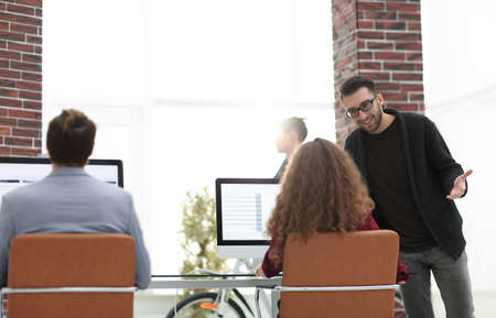 rear view.business team sitting at Desk