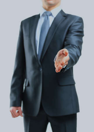Businessman giving his hand for a handshake.の写真素材