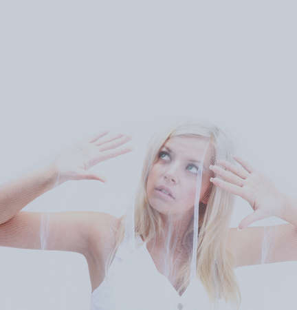 Beautiful woman with long straight blond hair. Fashion model posing at studio.の写真素材