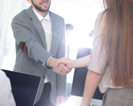 welcome and handshake of business partners