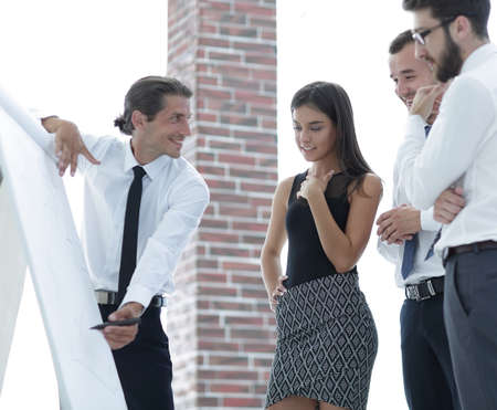 business team discussing new ideas,looking at the flip Charter .の写真素材