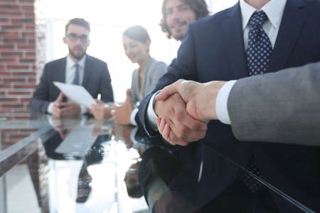 handshake of business partners in conference roomの写真素材
