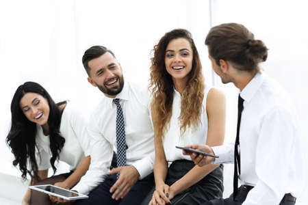 business team with tablet sitting in the office.