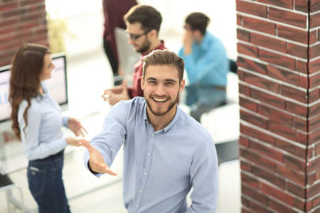 happy young business man portrait in bright modern office indoorの写真素材