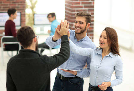 Happy business team  using tablet in office.の写真素材