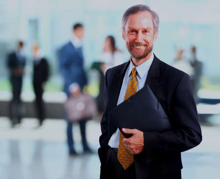 Successful businessman at the office leading a group.の写真素材