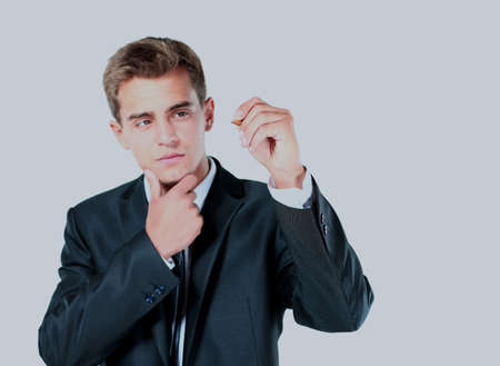 businessman writing something on glass board with marker.の写真素材