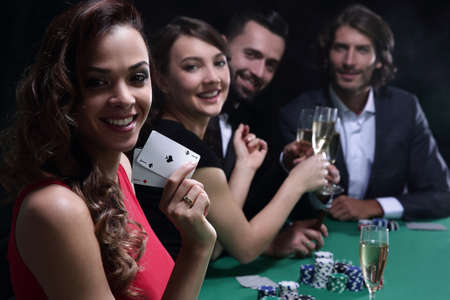 adult group celebrating friend winning blackjack