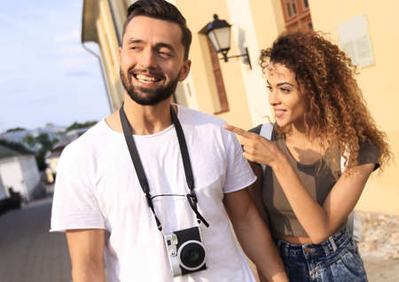 Happy tourists walking around the city and enjoying the viewの写真素材