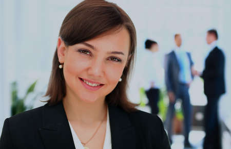 Face of beautiful woman on the background of business people.