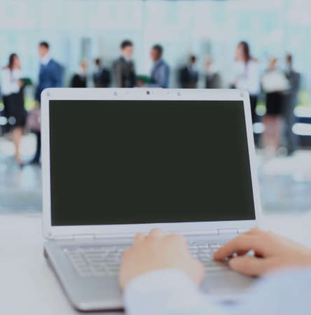 Person Typing on a modern laptop in an office.