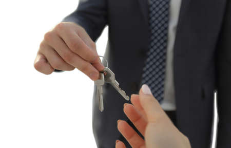 Estate Agent Giving House Keys To Personの写真素材