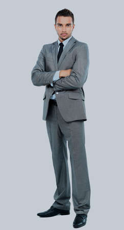 Full body portrait of happy smiling business man, isolated on white background.の写真素材