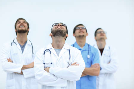confident medical team looking up.isolated on whiteの写真素材