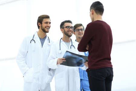 doctor gives the patient an x-rayの写真素材