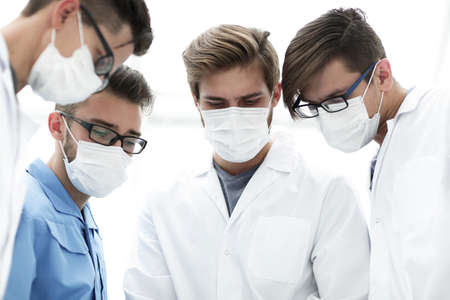 closeup. a team of doctors in protective masks.の写真素材