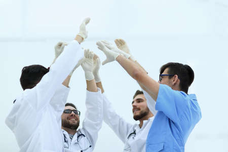 surgical team raising their handの写真素材
