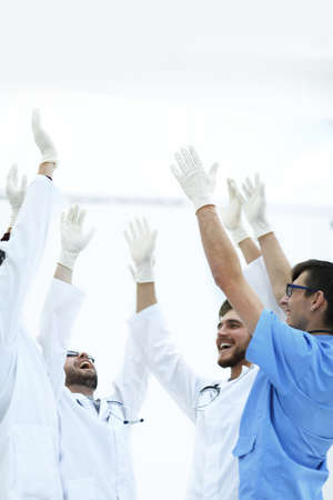 surgical team raising their handの写真素材