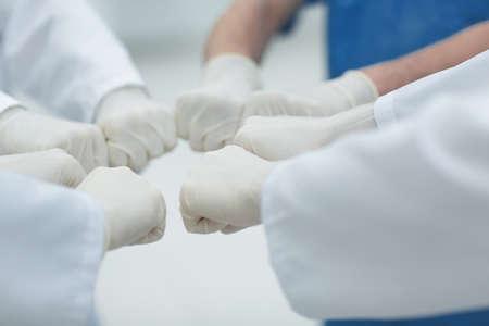 Doctors and nurses coordinate hands. Concept Teamwork in hospital