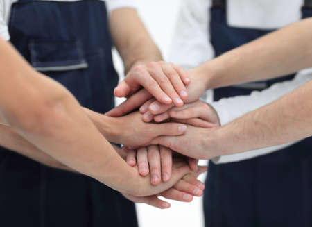 Team of movers showing unity, People putting their hands togethe