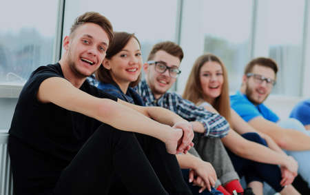 Happy young group of people standing togetheの写真素材