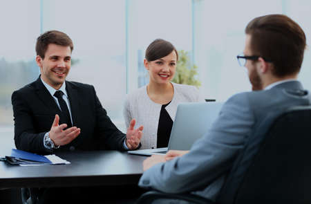 Happy business people talking on meeting at officeの写真素材