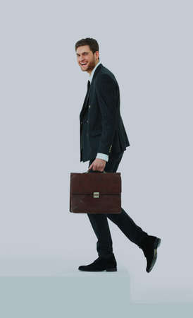 Businessman up the staircase over white background. ready for your designの写真素材