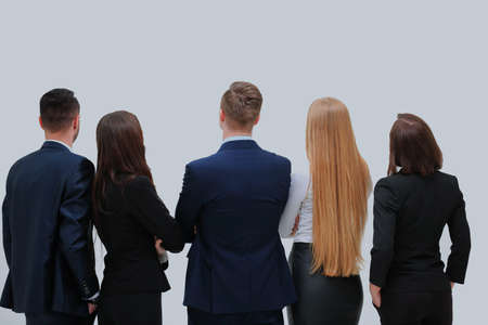 business people from the back - looking at something over a white background.の写真素材