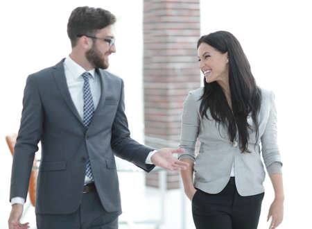 employees of the company discuss working issues standing in the officeの写真素材