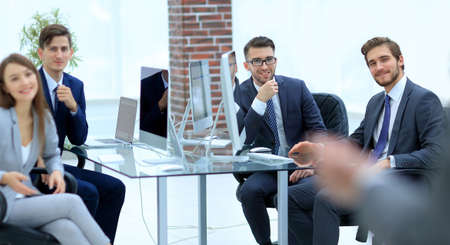 group of business people at a meeting on the background of offic