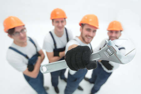 closeup.a team of builders showing a pipe wrenchの写真素材